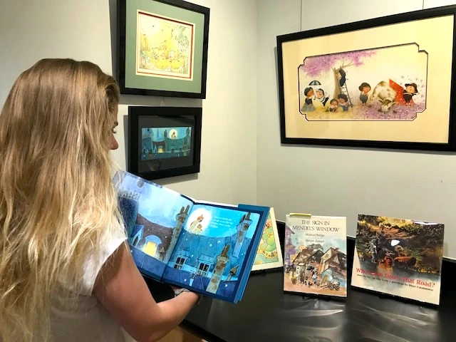 Child reading picture book