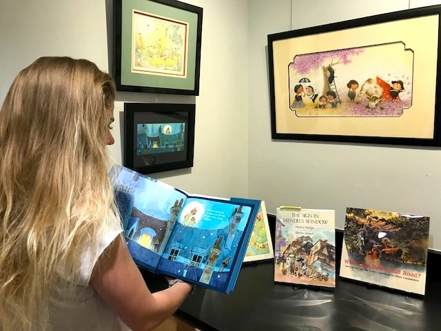 child is reading a book