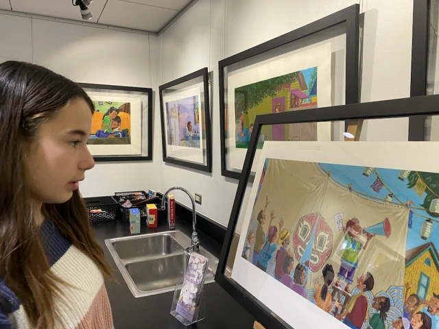 Eliette (7th grade) considers an illustration from the book Sumo Libre.