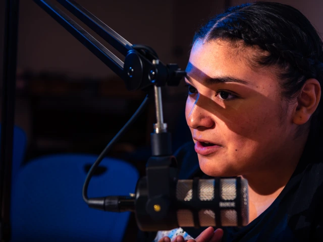 Teen speaks into a microphone