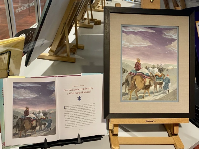 illustration of the silk road next to a book open to the page showing the same illustration