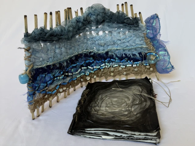 Handmade book evoking ocean shore