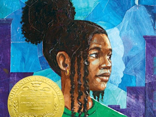 A young Black girl looks to the right. 