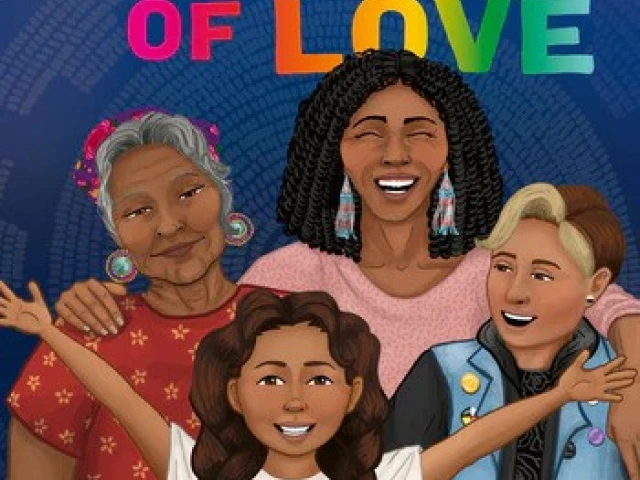 Four Indigenous people stand together smiling.