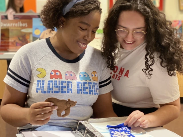 U of A students delighted by a tactile copy of The Mitten