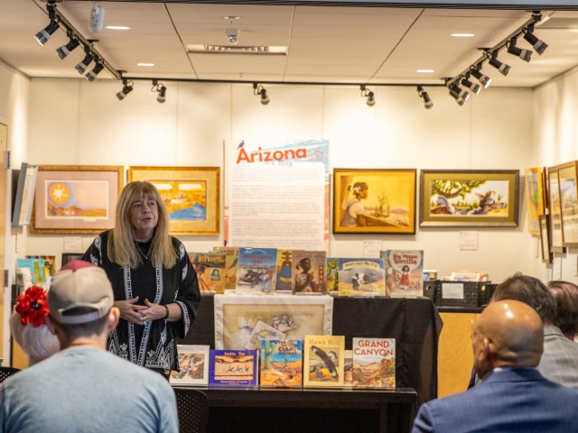 Kathy Short presenting the exhibit at reception