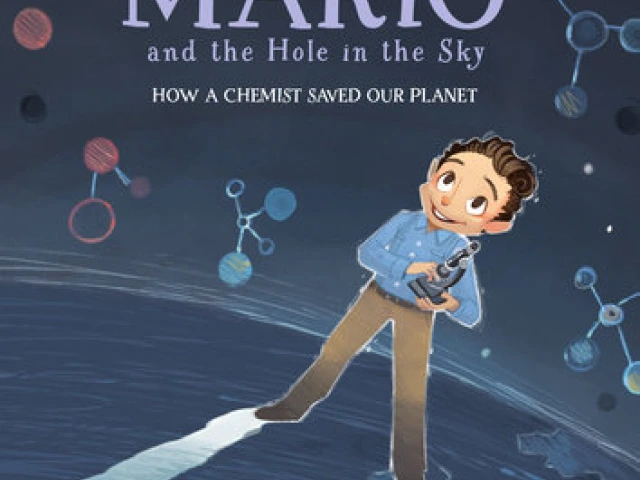 Boy holding a microscope