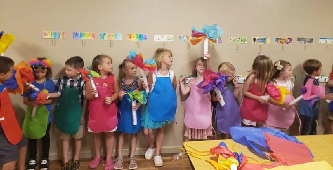 Figure 1. First graders holding their Olympic torches made in art class