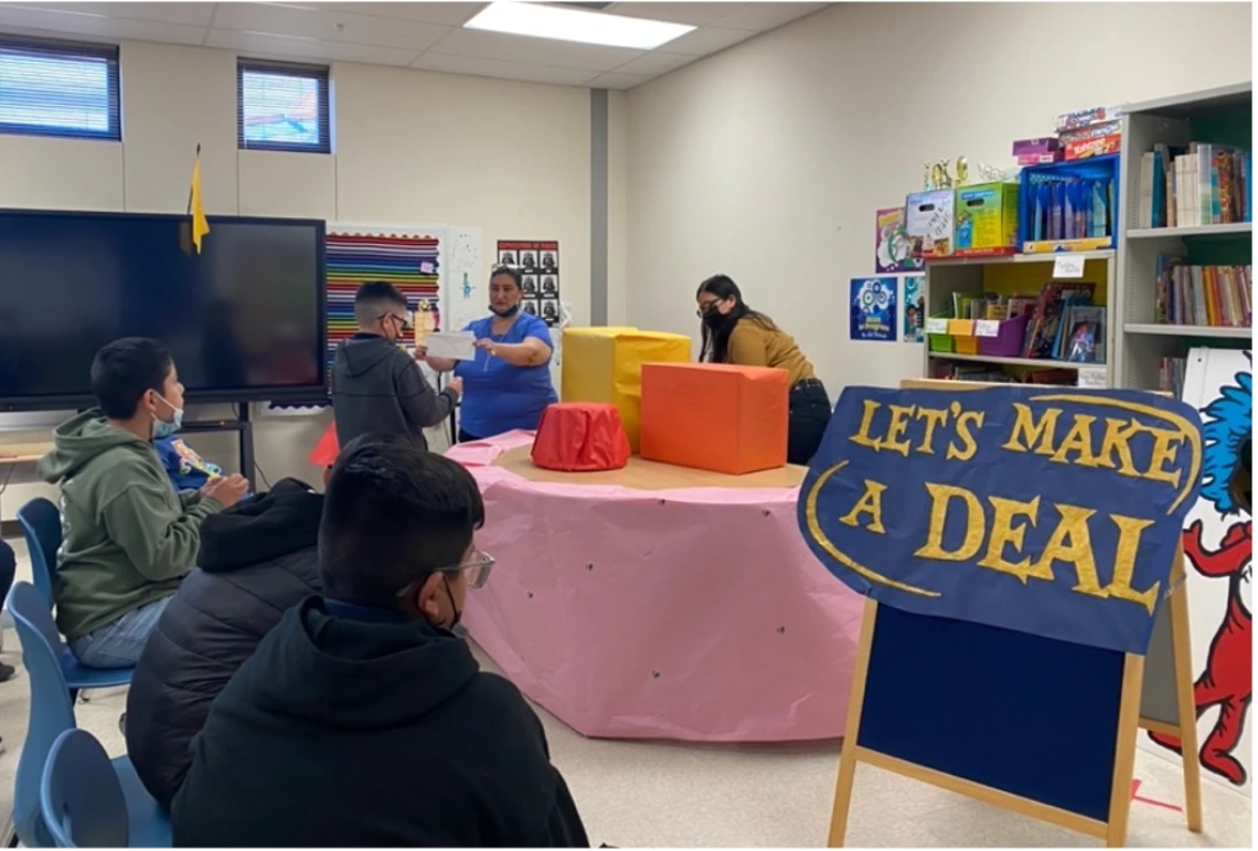 Mrs. Rodriguez Barters with a Student