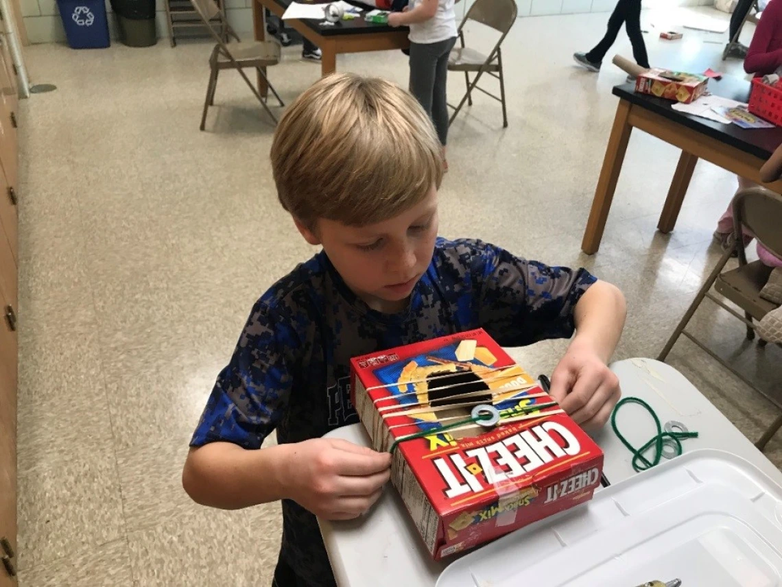 Ben worked hard to add the washer seen here to his strumming instrument