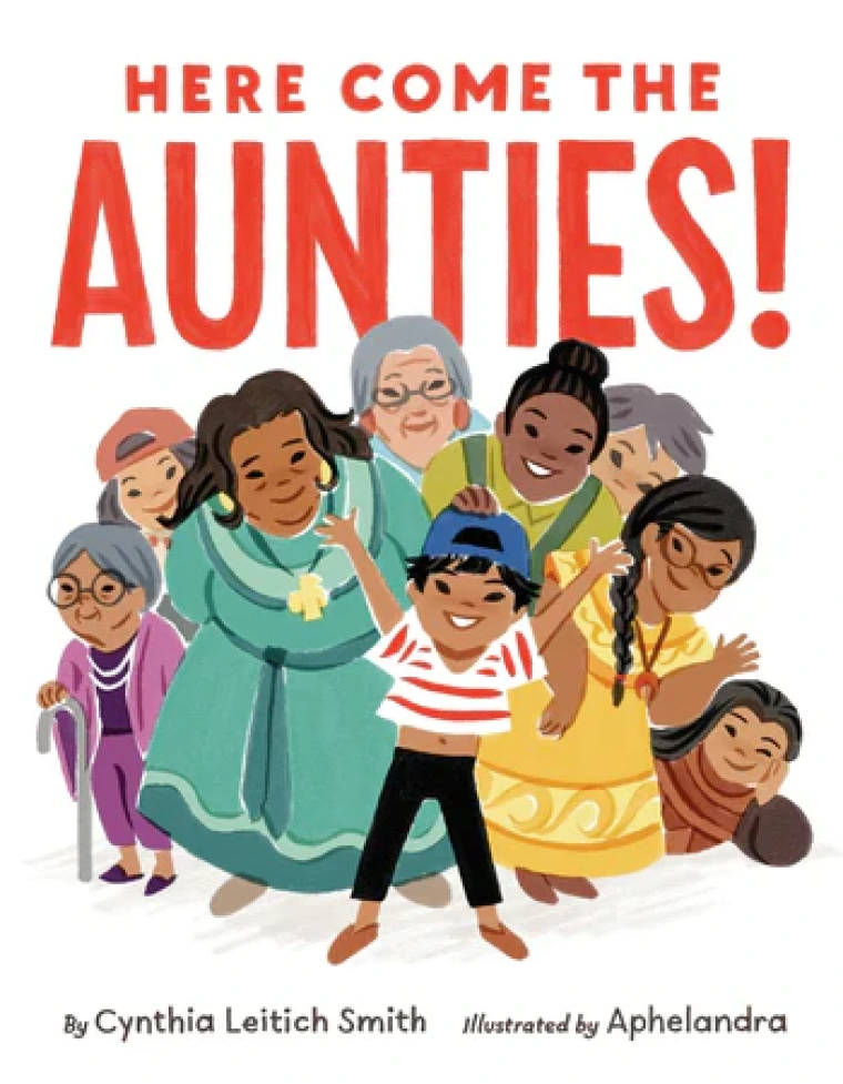 A young child surrounded by a group of aunties