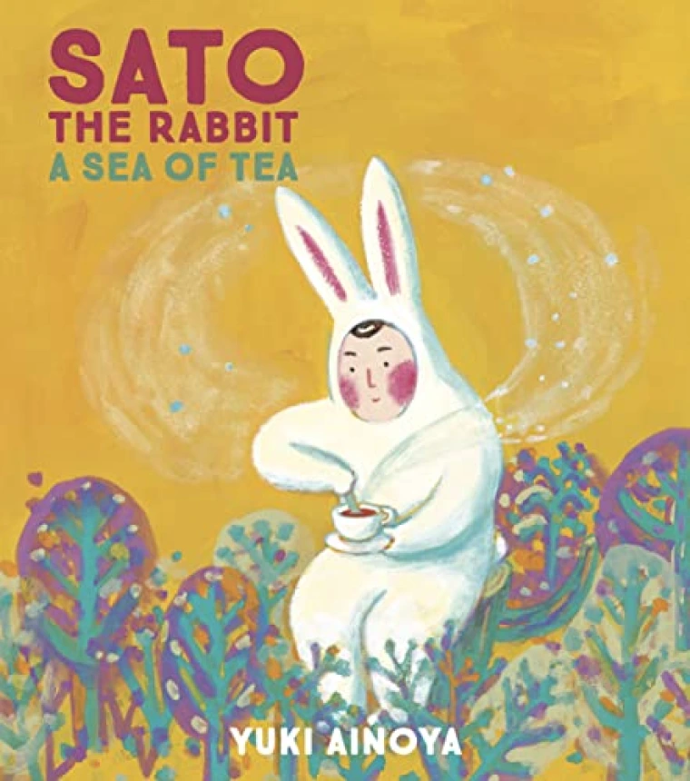 A man in a white rabbit suit stirs a cup of tea.
