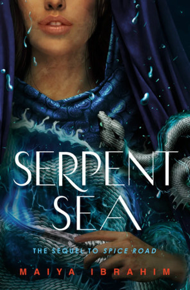 Close up of a young girl holding a blue serpent.