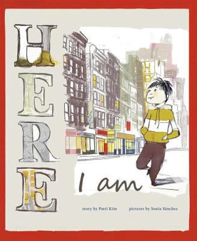 A young boy walks through a city.