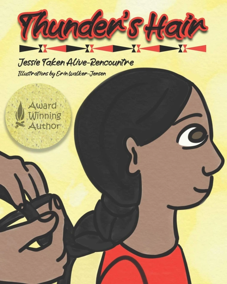 A young child gets his hair braided 
