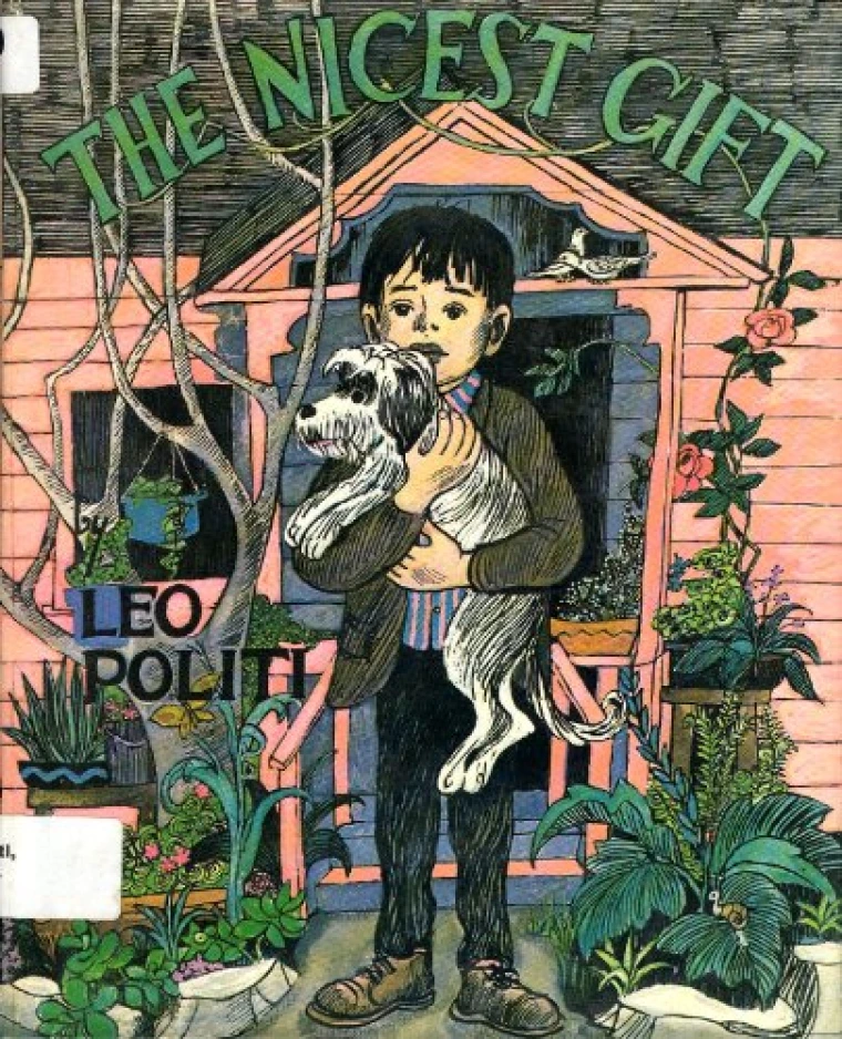 A child is in front of his house hugging his dog tightly 