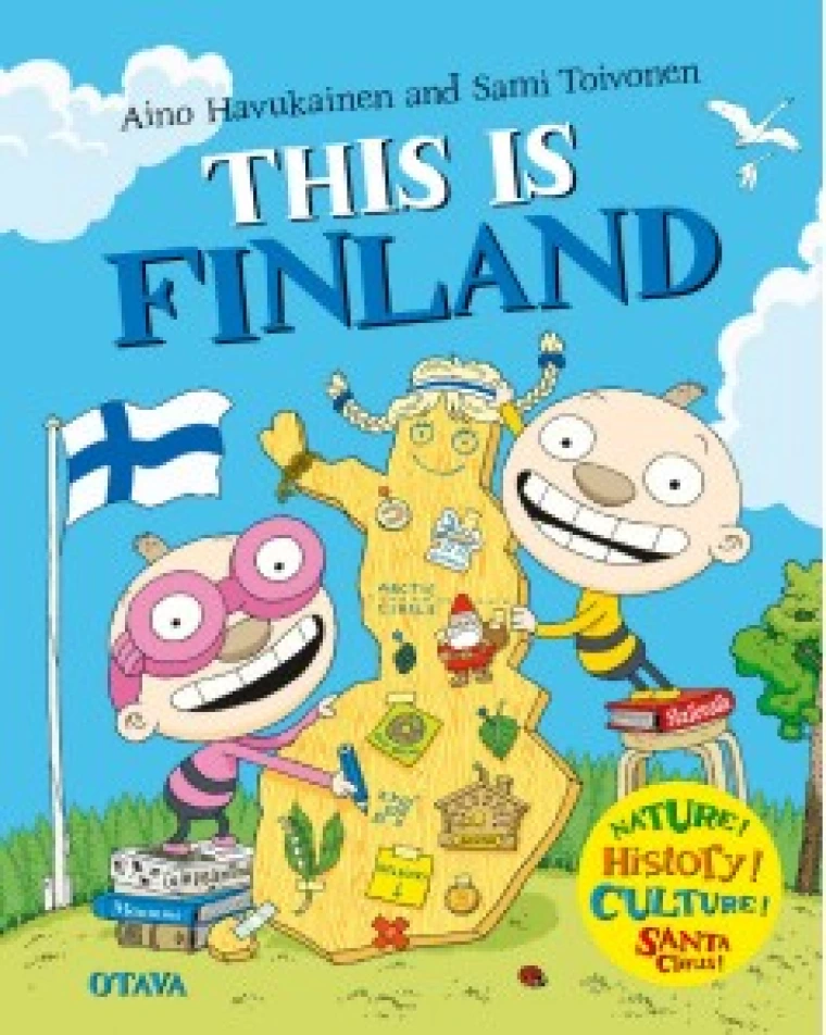 Two children draw on a cardboard maskot. A flag of Finland flies behind them.