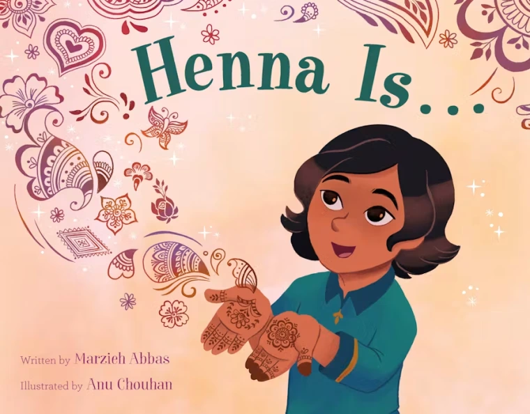 A young girl shows her palms which are decorated with Henna, the patterns flying off her hands.
