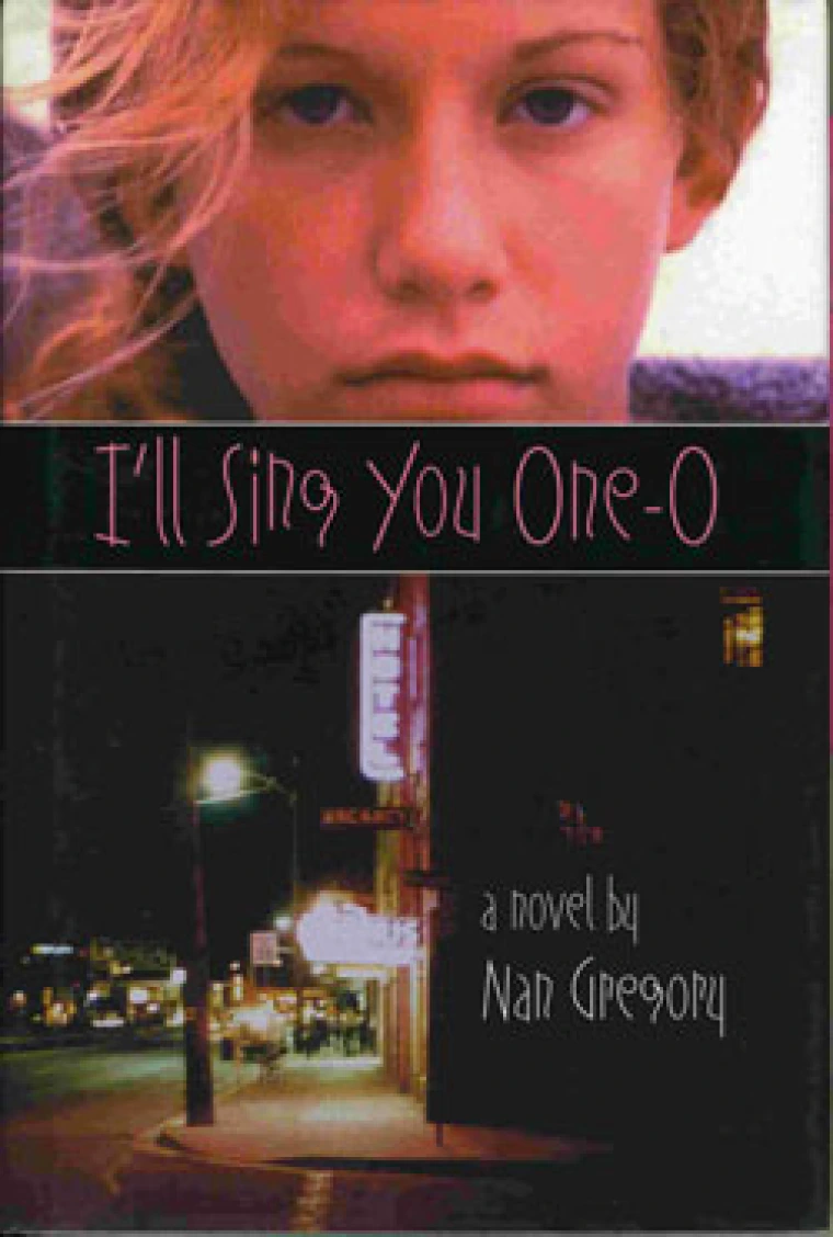On the top half of the book is a woman staring at the reader, in the middle is the title of the book, and on the bottom half is a dark street with city lights