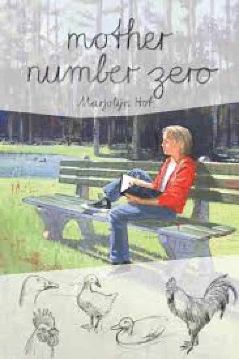 A lady is sitting on a bench outside reading her book