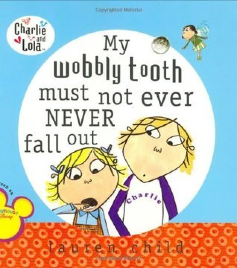 A little girl is showing her tooth falling out to an older girl