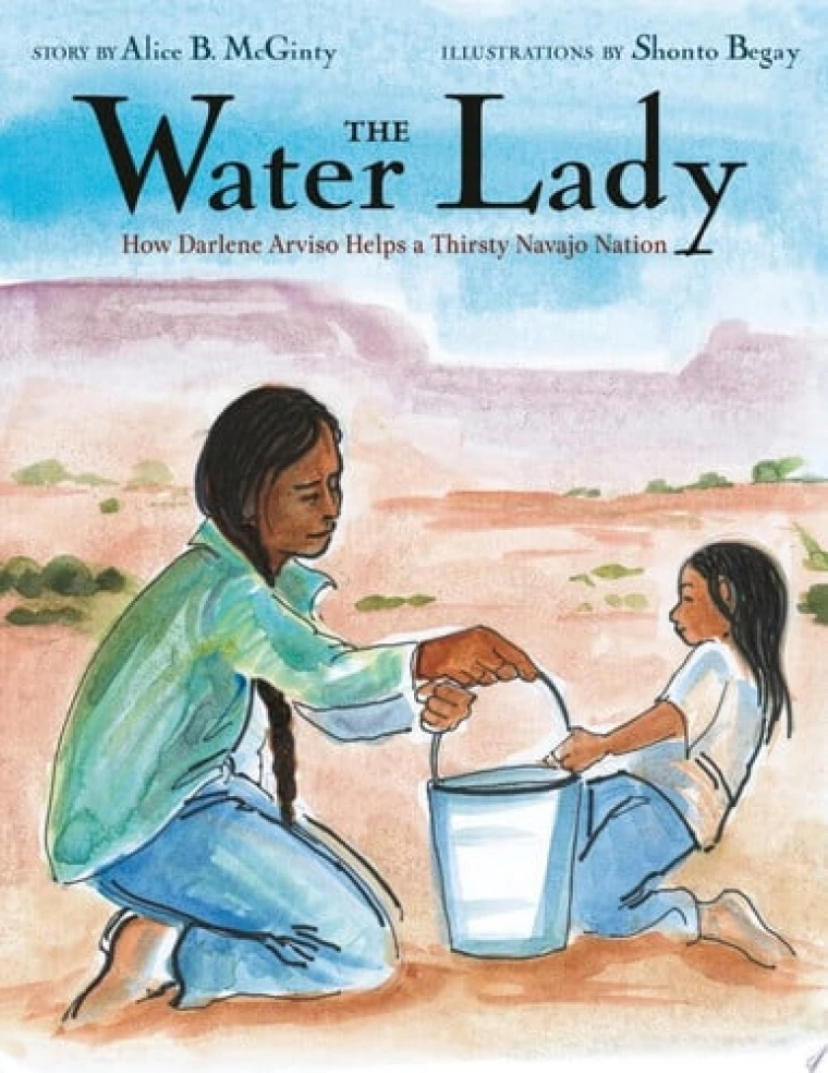 A girl is holding a bucket of water and passing it to a younger girl