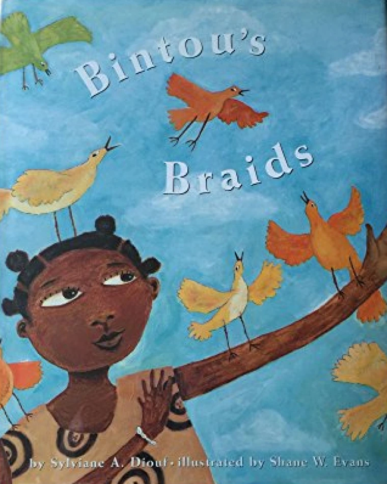 A young Black girl holds out an arm that orange and yellow birds perch on.