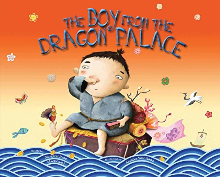 A young boy in ragged clothes sits on a rock in the middle of the ocean.