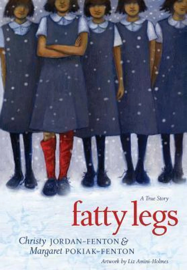 A group of girls in school dresses stands together in the snow. Only one has red socks.