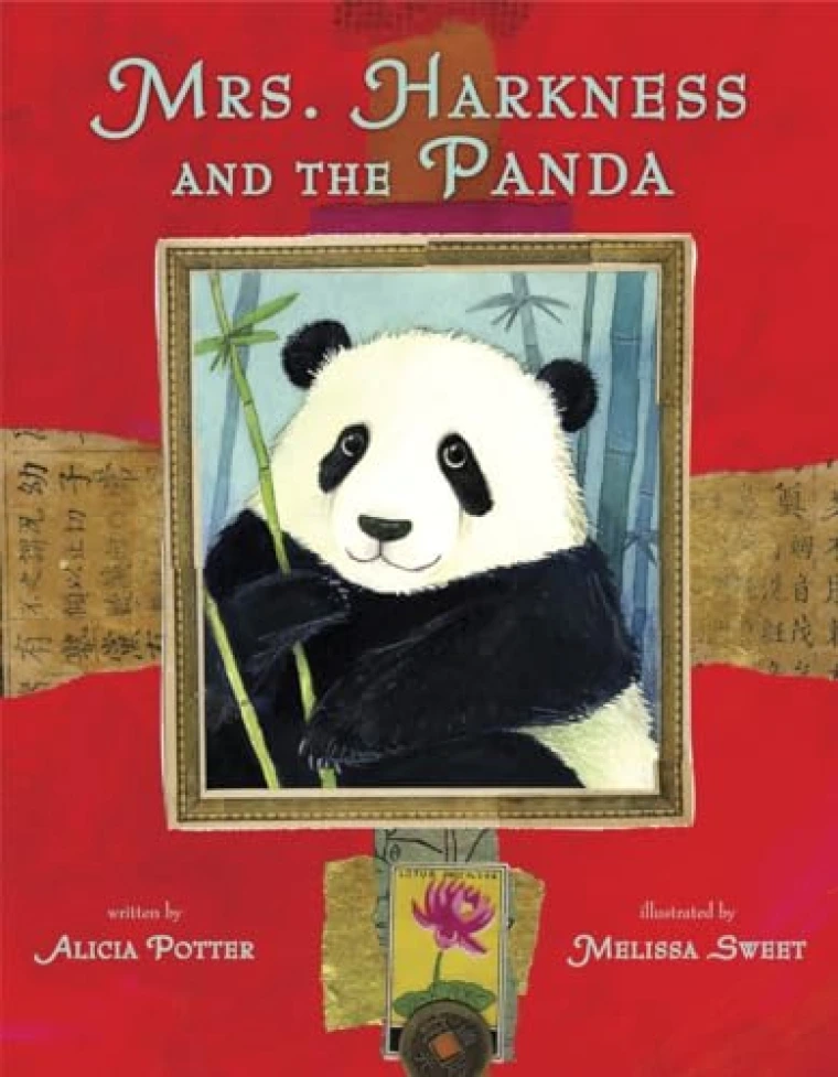 A panda holding bamboo.