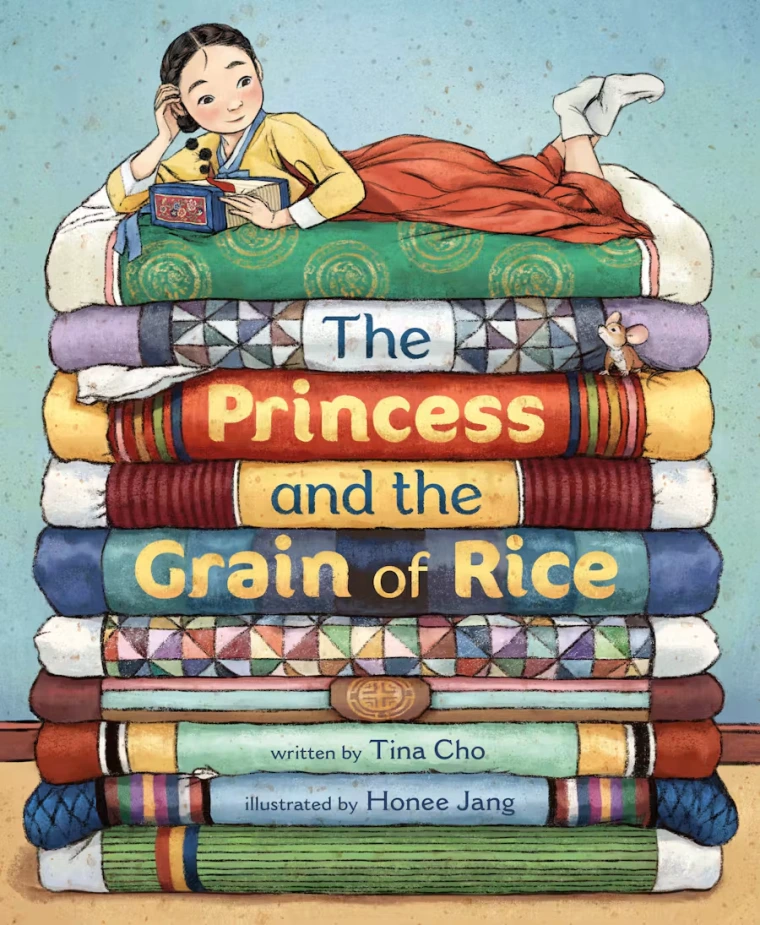 A Korean princess lays on top of a stack of mattresses.
