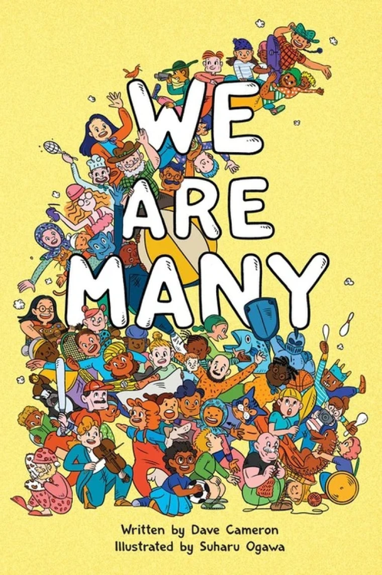 A group of diverse people crowd together joyfully.