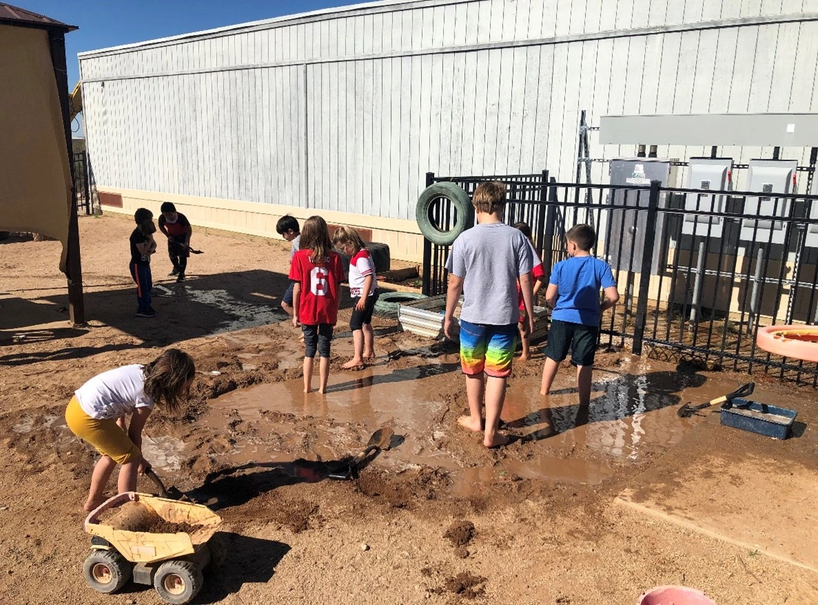 Group of students exploring the Garhett’s waterway
