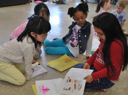 small group of students share their India books