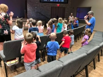 children singing in chapel