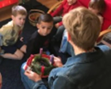 Children learning about the power of candlelight