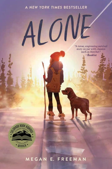 Girl and dog stare into the sunset