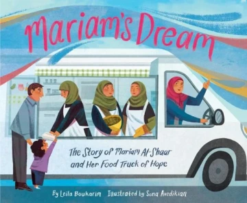 A woman in a red hijab is in the driver’s seat of a food truck 