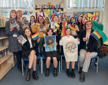 Staff and pupils with Cinderella is Dead by Kalynn Bayron