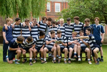 A school rugby team with Heartstopper by Alice Oseman