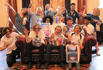     School staff & book club members with Wranglestone by Darren Charlton and Broken Hearts & Zombie Parts by William Hussey 