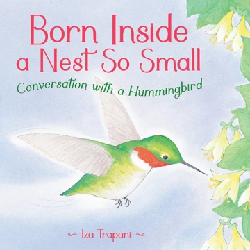 A green hummingbird before white flowers.