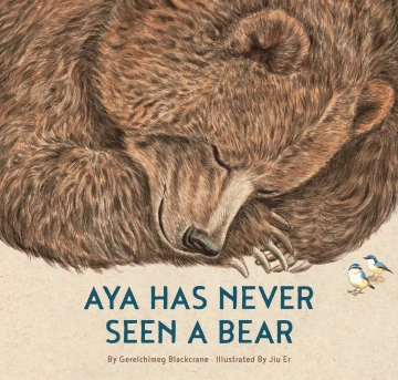 Close up of a sleeping bear with two little birds looking at it.