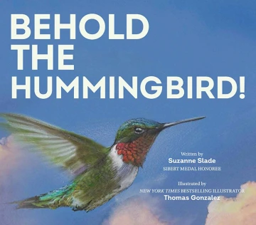 A close up of a vibrant green hummingbird with a ruby throat. 