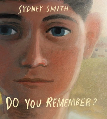 Close up of a boy’s neutral face. 