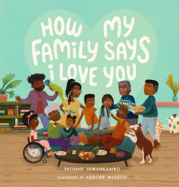 A large multi-generational Black family gathers together in a home.