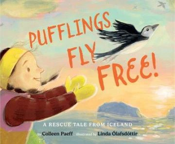 A child tosses a baby puffin into the sky. 