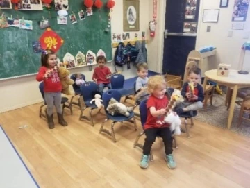 Our chair “plane” flying us (and our stuffed animal friends) to see the dragon dance.