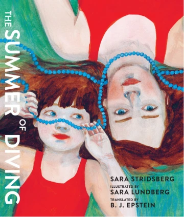 A girl and a woman in red swimsuits lay in the grass head to head with a string of blue beads connects them. 