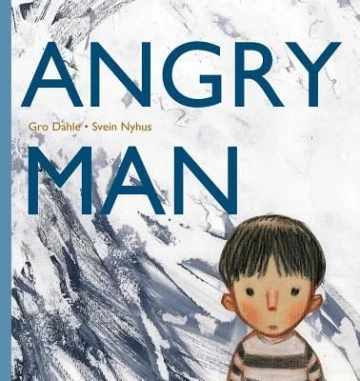 A young boy with straight black hair in a black and white striped shirt looks at the reader with open eyes and a small mouth. 